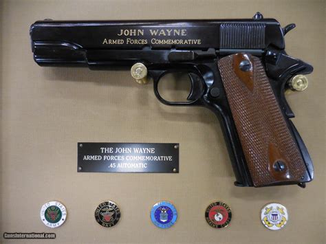 All artwork is featured in stunning 24-karat gold with blackened patina. . John wayne commemorative 45 pistol